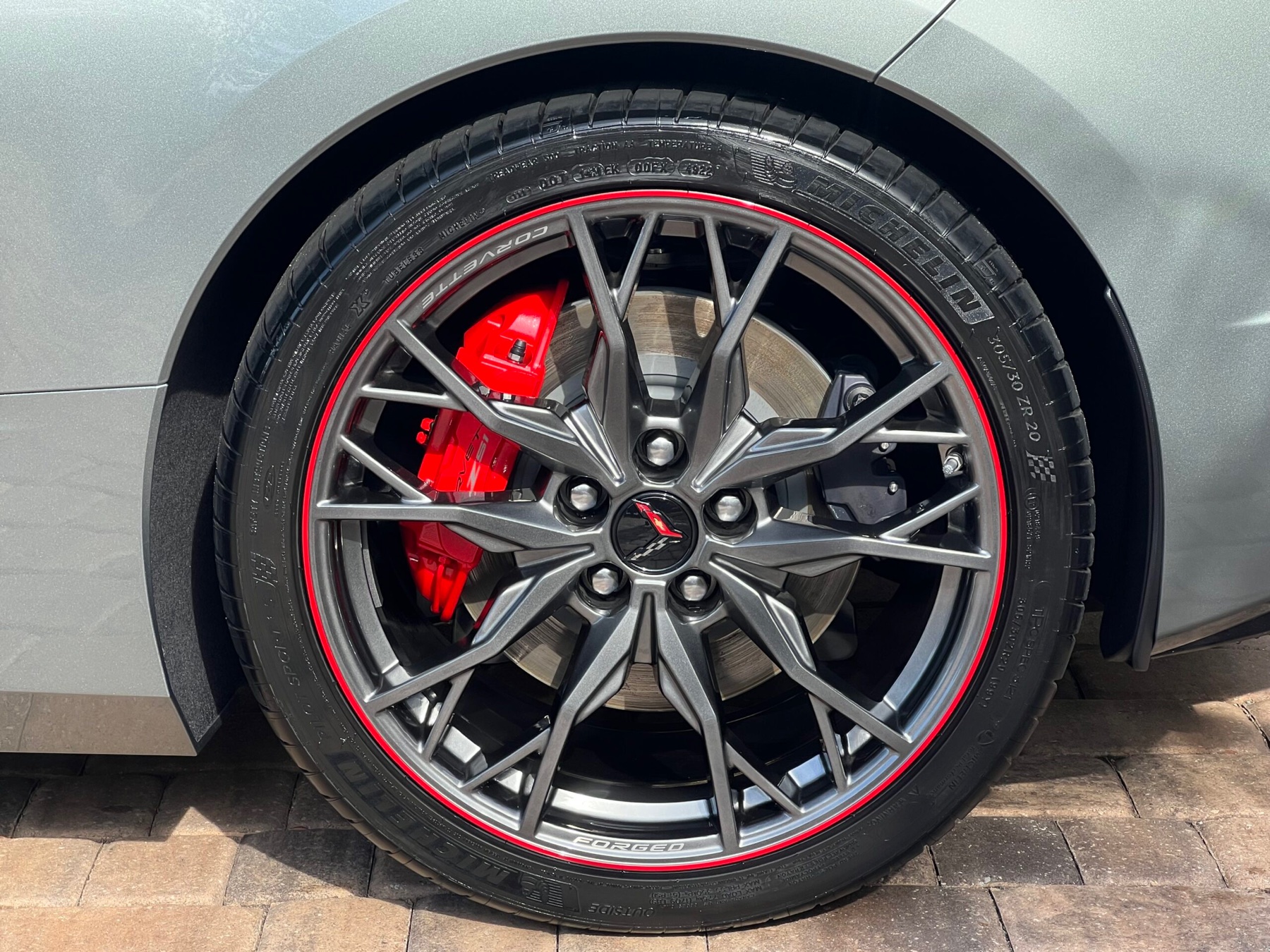 Corvette Z51 wheel, red brake caliper, and polished metallic paint